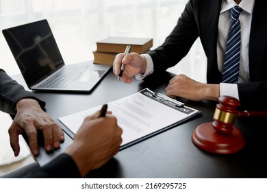 Businessman and lawyer discuss the contract document. Treaty of the law. Sign a contract business. - Shutterstock ID 2169295725