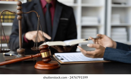 Businessman and lawyer discuss with legal advisor in lawyer's law office. Concept of legal and justice consulting services. - Powered by Shutterstock