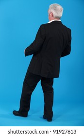 Businessman Leaning Backwards