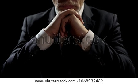 Businessman leaning on elbows, professional lawyer listening patiently to client