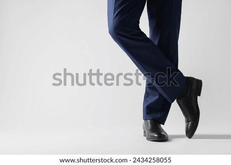 Businessman in leather shoes on white background, closeup