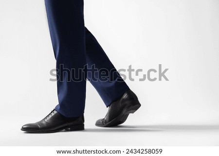 Businessman in leather shoes on white background, closeup