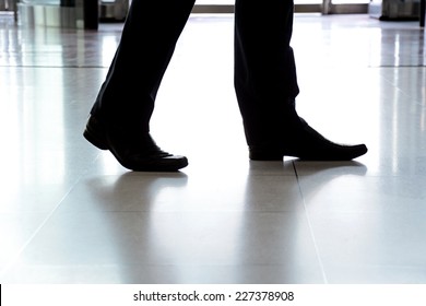 Businessman Legs With Black Leather Shoes Walking On The Floor