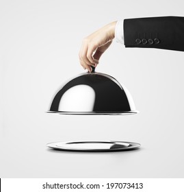 Businessman Lifting The Lid Of The Tray 