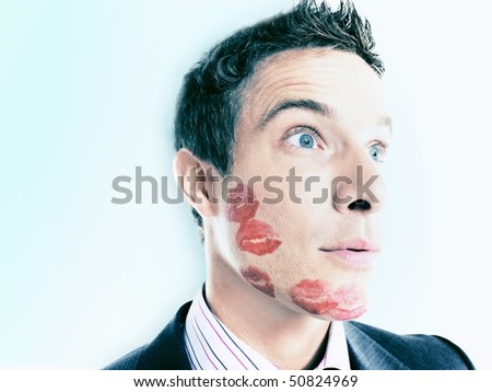 Businessman with lipstick kiss-marks