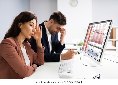 Businessman Looking At Audit Data And Financial Loss. Stock Down