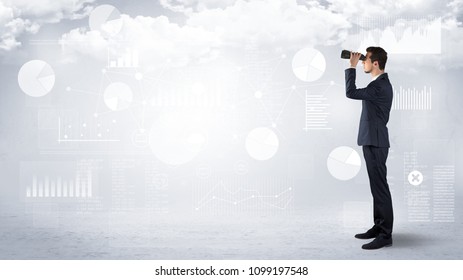 Businessman looking forward with binoculars cloudy background and graphs, charts around