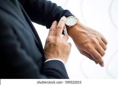 businessman-looking-his-watch-office-260nw-590522015.jpg