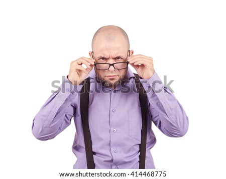 Businessman looking over glasses.bald man in a purple shirt looking through glasses.
