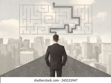 Businessman looking at road with maze and solution concept