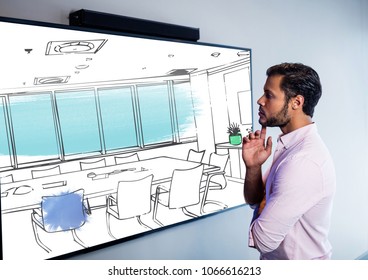 Businessman Looking The Screen On The Wall And Thinking On The New Desing Of The New Meeting Room