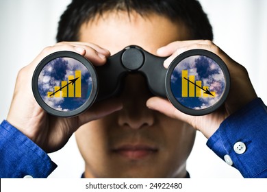 A Businessman Looking Through Binoculars, Seeing Conflicting Trends In Earnings Prediction, Can Be Used For Business Vision Or Business Prediction Concept