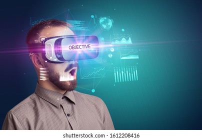 Businessman Looking Through Virtual Reality Glasses With OBJECTIVE Inscription, New Business Concept