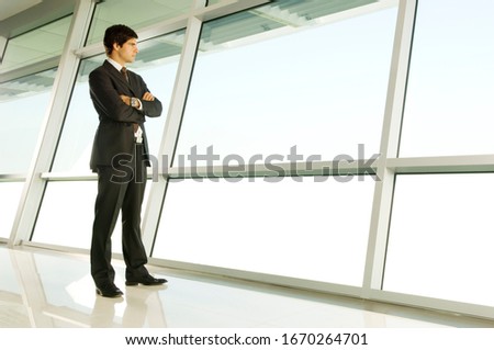 A businessman looking through a window
