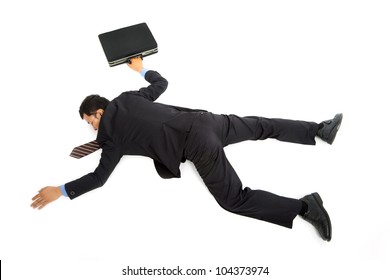 businessman lying down on the ground