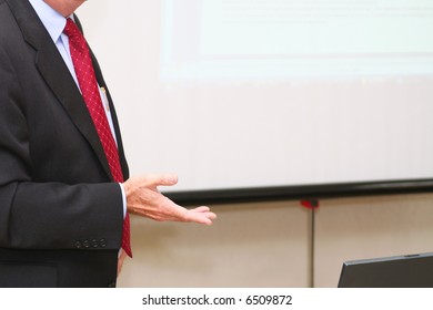 Businessman makes speech in the boardroom - Powered by Shutterstock