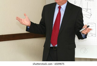 Businessman makes speech in the boardroom - Powered by Shutterstock