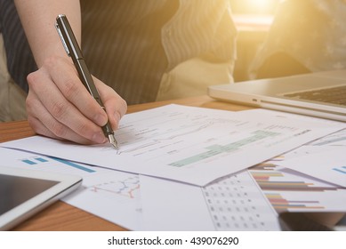 Businessman making presentation on office table with smart phone and laptop computer and graph business with social network diagram and business strategy digital layer effect at the office - Shutterstock ID 439076290