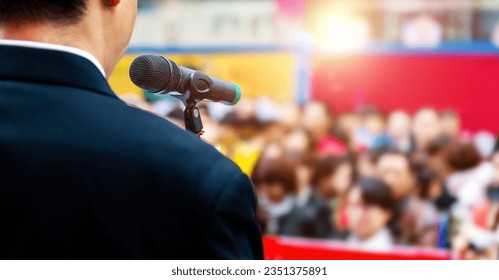 Businessman making a speech in front of crowds - Powered by Shutterstock