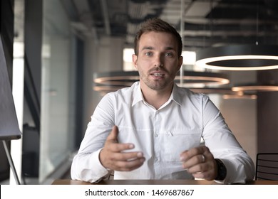 Businessman making video call, looking at camera and talking, discussing strategy with partners online, millennial business coach mentor recording webinar, hr manager holding distance job interview - Shutterstock ID 1469687867