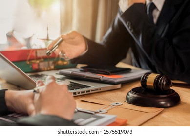 Businessman and Male lawyer or judge consult having team meeting with client, Law and Legal services concept in office.