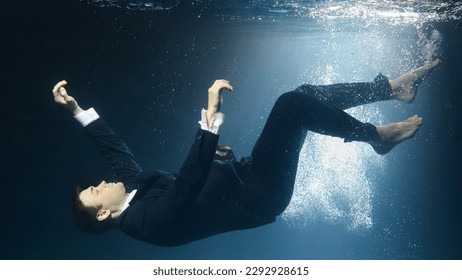 Businessman man in a suit, drowning under water - Powered by Shutterstock