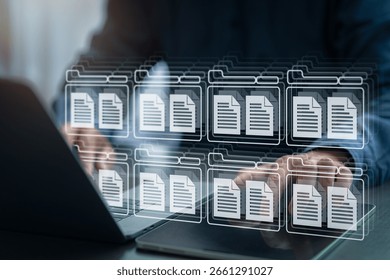 Businessman managing digital documents using virtual folder system on computer and tablet, representing cloud data storage, digital archive, and efficient document management in modern business.