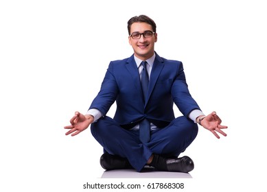 Businessman meditating on the floor isolated on white - Powered by Shutterstock