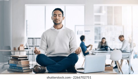 Businessman, meditation and yoga on desk at startup, office or workplace for digital marketing. Happy worker man, relax and sitting on table for zen mindfulness in workplace at social media company - Powered by Shutterstock