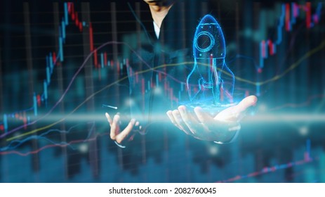 Businessman Or Merchant Showing Hologram Stock With The Direction Of Rising Like A Rocket In Hand Finance Concept, Stock Market, Fast Growing Business Like A Rocket. 