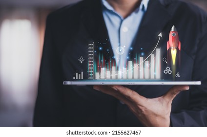 Businessman Or Merchant Showing Hologram Stock With The Direction Of Rising Like A Rocket In Hand Finance Concept, Stock Market, Fast Growing Business Like A Rocket. 