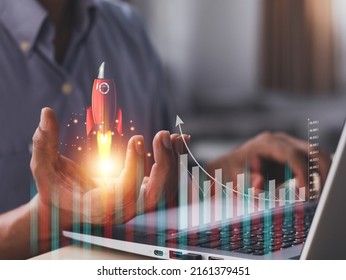 Businessman Or Merchant Showing Hologram Stock With The Direction Of Rising Like A Rocket In Hand Finance Concept, Stock Market, Fast Growing Business Like A Rocket. 