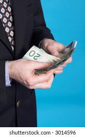 businessman and money over blue background - Shutterstock ID 3014596