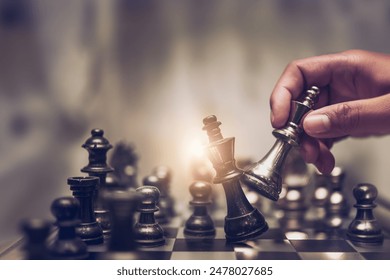 Businessman moving chess piece on chess board game concept for ideas and competition and strategy, business success concept, business competition planning teamwork strategic concept.	
 - Powered by Shutterstock