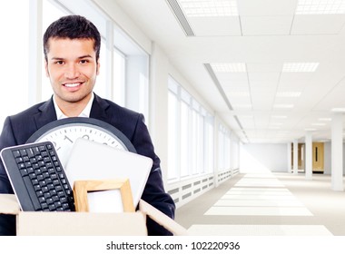 Businessman Moving Into A New Office Holding A Box