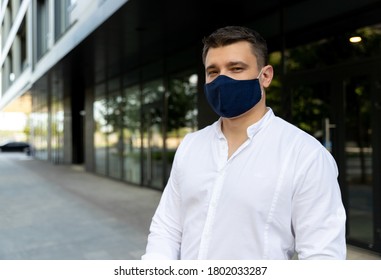 Businessman Near Office In Protective Cloth Face Mask. Man In Casual Clothes Standing On The Street. New Social Behavior New Normal Concept