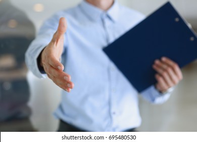 Businessman offer hand to shake as hello in office closeup. Serious business, friendly support service, excellent prospect, introduction or thanks gesture, gratitude, invite to participate concept - Shutterstock ID 695480530