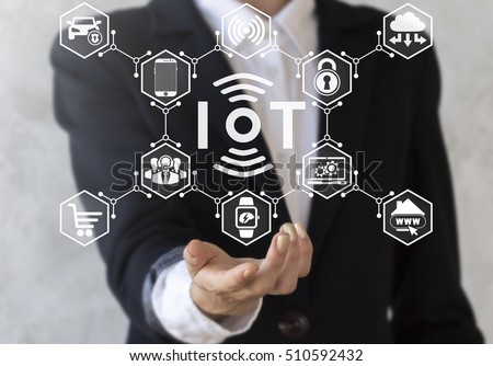 Businessman offer iot icon with wireless symbol and tech devices network. Internet of things concept. IoT solution represent, symbol connected. Intelligent house, car, laptop, watch, smartphone