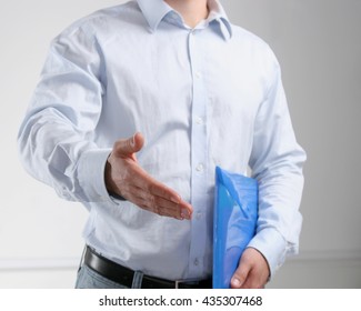 Businessman offering his hand for handshake. - Shutterstock ID 435307468