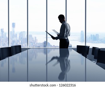 businessman in office and city in window
