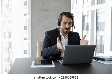 Businessman Office Employee Wear Headset Talks To Client, Counselling Using Videoconference App, Assist Remotely, Take Part In Virtual Meeting By Business. Distance Communication, Negotiations Concept