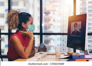 Businessman Or Office Worker Are Working And Video Meeting Online Conference And Wear Mask For Protect Covid-19 Or Corona Virus Disease But Business Must Be Continuous, Healthcare Concept 