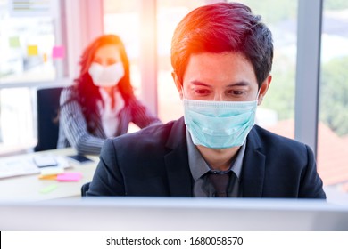 Businessman or office worker are working and wear mask for protect Covid-19 or corona virus disease but business must be continuous, healthcare concept  - Powered by Shutterstock