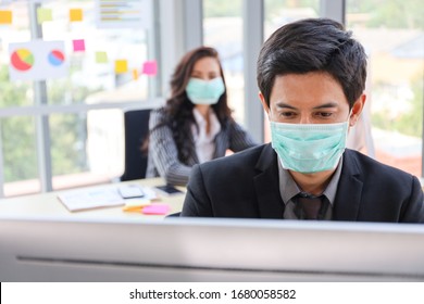 Businessman or office worker are working and wear mask for protect Covid-19 or corona virus disease but business must be continuous, healthcare concept 