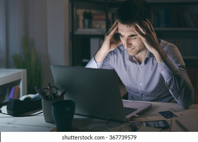 Businessman In The Office Working Late At Night And Having A Bad Headache, Overwork And Stress Concept