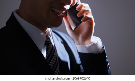 Businessman on a black background - Shutterstock ID 2069902640
