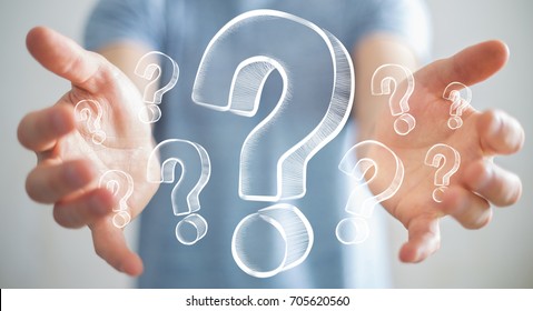 Businessman on blurred background holding hand drawn question marks - Shutterstock ID 705620560