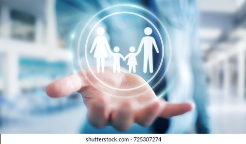 Businessman on blurred background holding family interface in his hand 3D rendering - Powered by Shutterstock