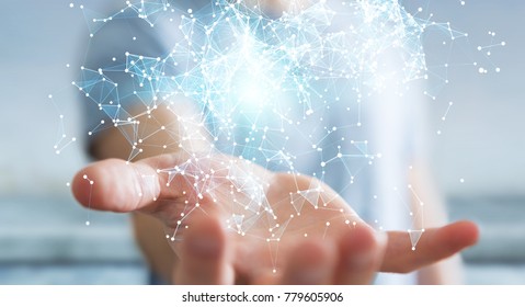 Businessman on blurred background holding flying network connection 3D rendering - Shutterstock ID 779605906