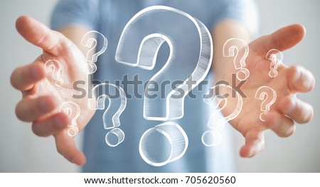 Businessman on blurred background holding hand drawn question marks